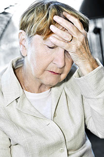 an old woman experiencing a headache
