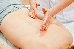 hands massaging somebody's back skin